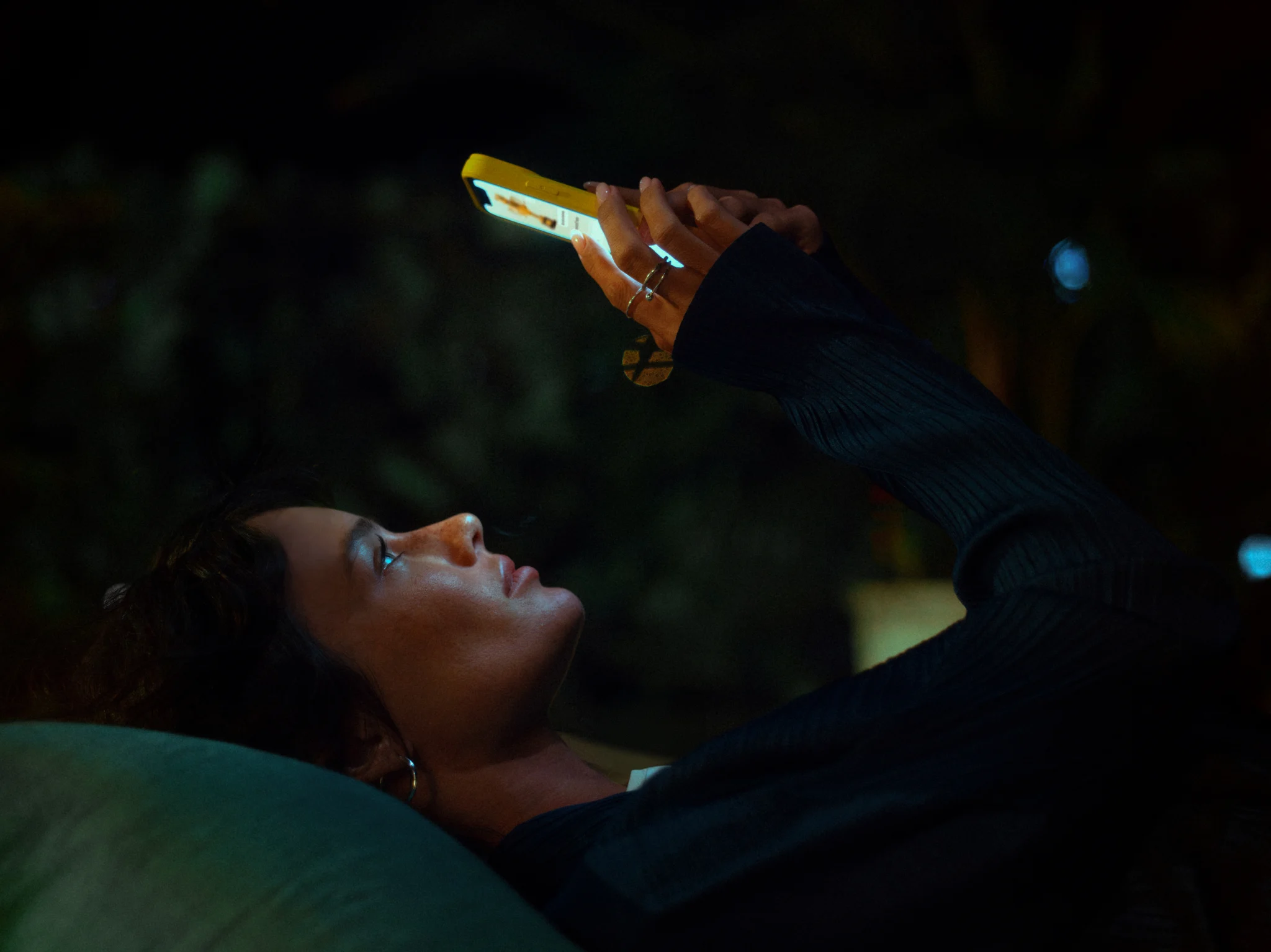 A person using a phone at night